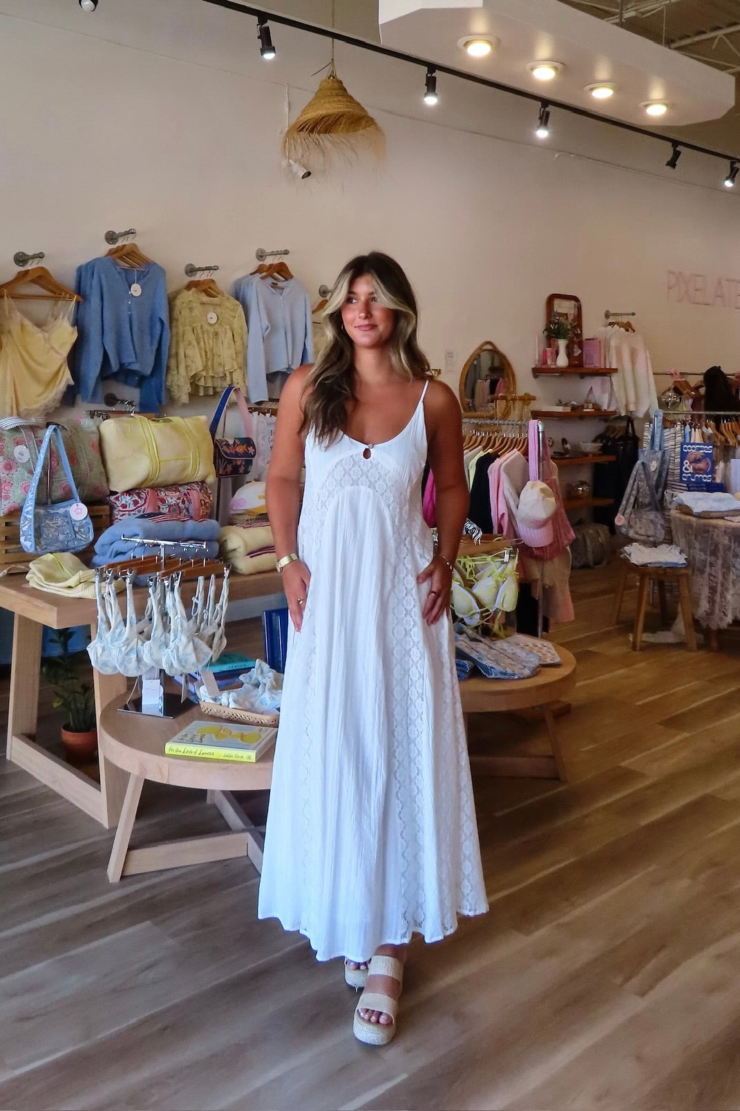 White, textured lace maxi dress with V neckline, front keyhole button, and adjustable open back, white maxi dress, white lace dress, boho maxi dress, bridal shower dress, bachelorette dress, graduation dress
