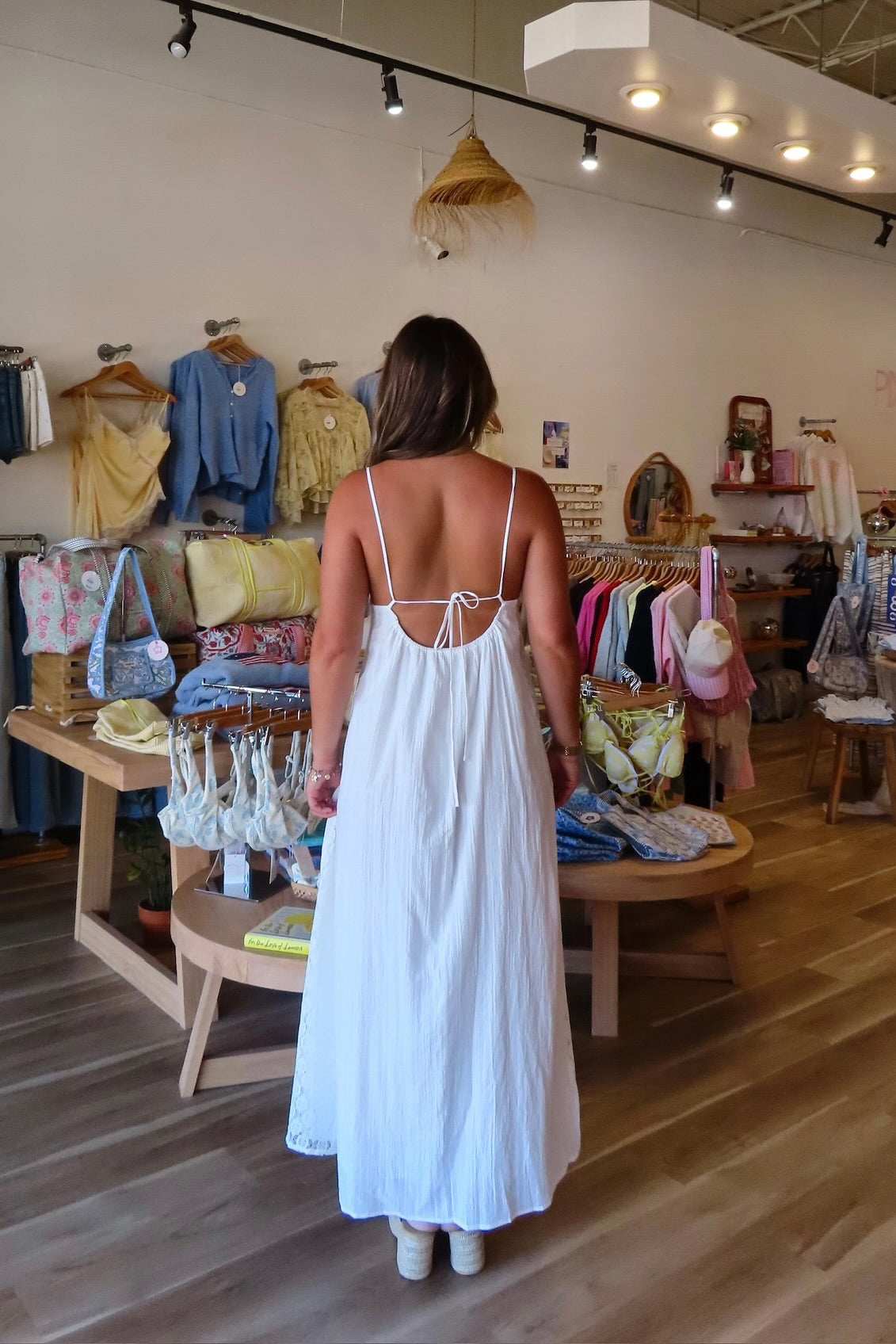 White, textured lace maxi dress with V neckline, front keyhole button, and adjustable open back, white maxi dress, white lace dress, boho maxi dress, bridal shower dress, bachelorette dress, graduation dress
