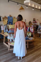 White, textured lace maxi dress with V neckline, front keyhole button, and adjustable open back, white maxi dress, white lace dress, boho maxi dress, bridal shower dress, bachelorette dress, graduation dress
