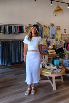 White, linen midi skirt with lace trim, lined interior elastic waistband, and side zipper | Pixelated Boutique, 757 Boutique, Virginia Beach Clothing Stores, Lace skirt, Linen skirt, Lace maxi skirt, Business casual midi skirt, white midi skirt, white lace skirt, vacation outfits