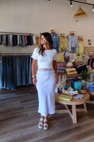 White, linen midi skirt with lace trim, lined interior elastic waistband, and side zipper | Pixelated Boutique, 757 Boutique, Virginia Beach Clothing Stores, Lace skirt, Linen skirt, Lace maxi skirt, Business casual midi skirt, white midi skirt, white lace skirt, vacation outfits