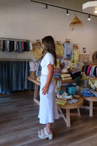 White, linen midi skirt with lace trim, lined interior elastic waistband, and side zipper | Pixelated Boutique, 757 Boutique, Virginia Beach Clothing Stores, Lace skirt, Linen skirt, Lace maxi skirt, Business casual midi skirt, white midi skirt, white lace skirt, vacation outfits