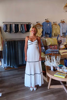 White, contrast trim maxi dress with sweetheart neckline, front keyhole, beaded straps, tiered hem, and back tie | Pixelated Boutique, Virginia Beach Boutique, white maxi dress, white lace dress, boho maxi dress, bridal shower dress, bachelorette dress, graduation dress