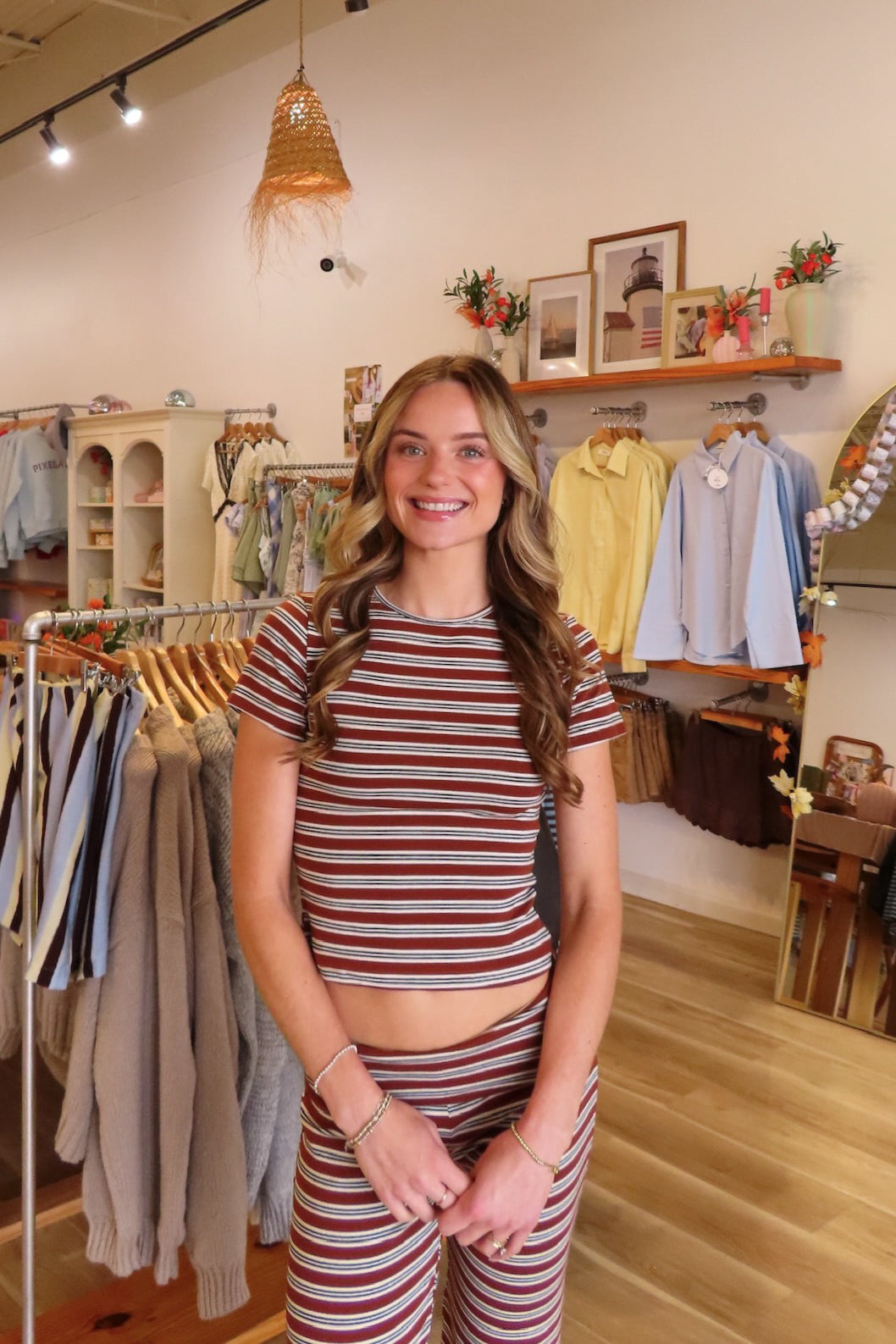 Brown, striped crop top with crew neckline and short sleeves and fitted pants with foldover waist
