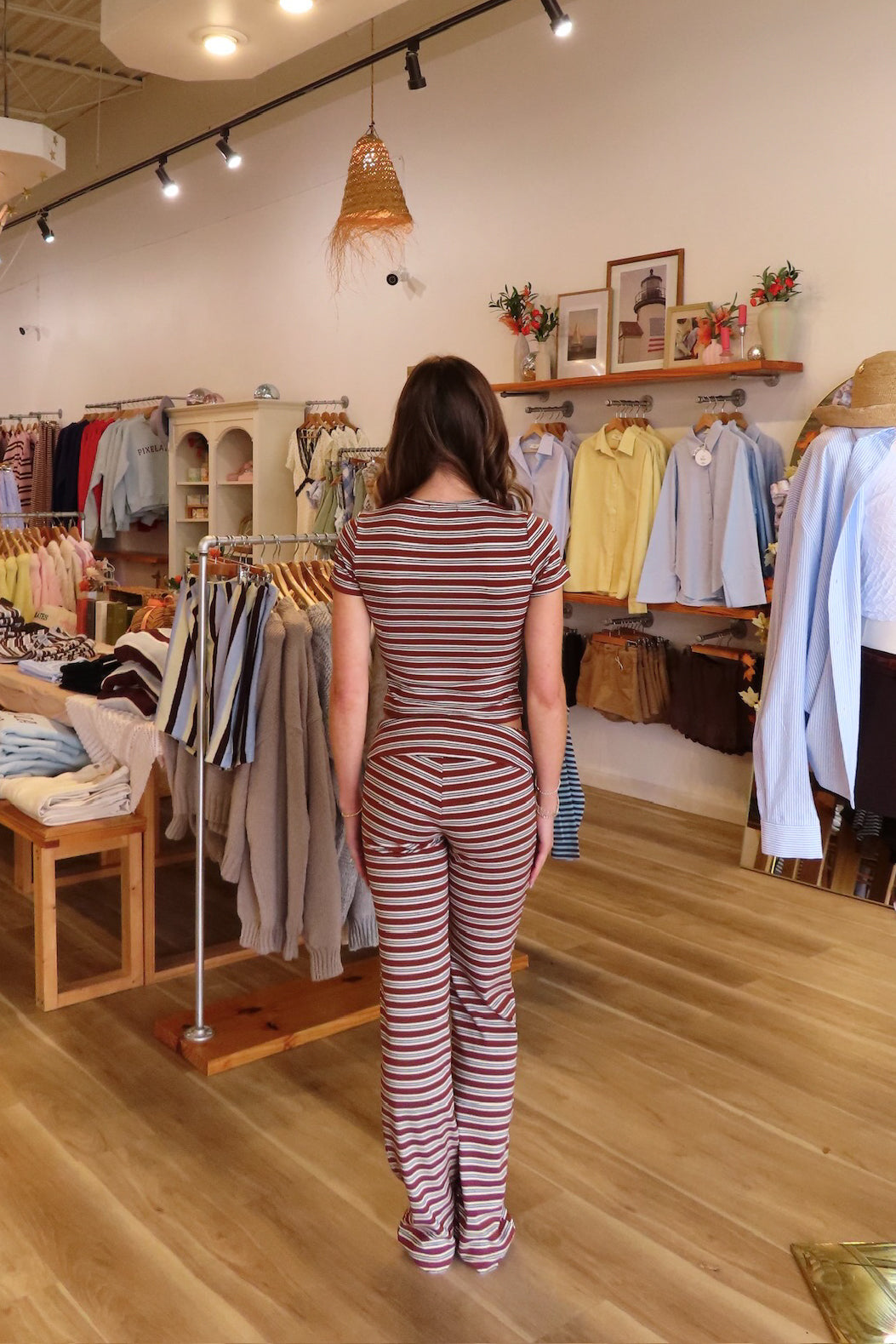 Brown, striped crop top with crew neckline and short sleeves and fitted pants with foldover waist