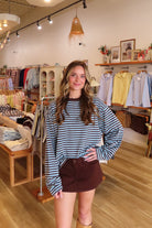 Blue and brown, striped top with long sleeves, drop shoulder, and oversized fit