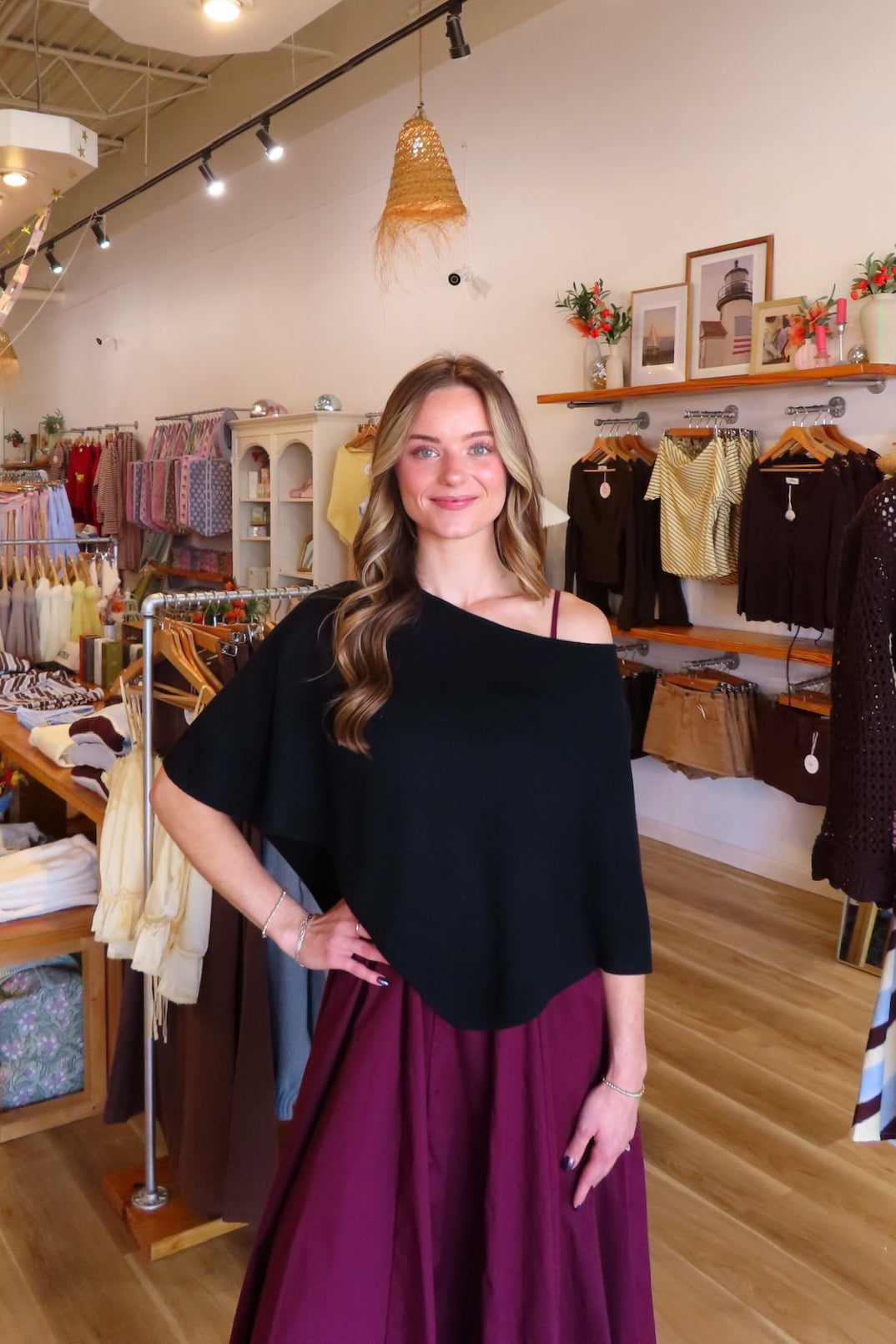 Black, knit poncho with boat neckline and asymmetrical hem | Pixelated Boutique, Boutique Shopping in Virginia Beach, Women’s Boutique, Fall Fashion, Fall Dresses, Fall Shopping, Trendy Fall Outfits, Women’s Fall Clothing, Casual Fall Outfit