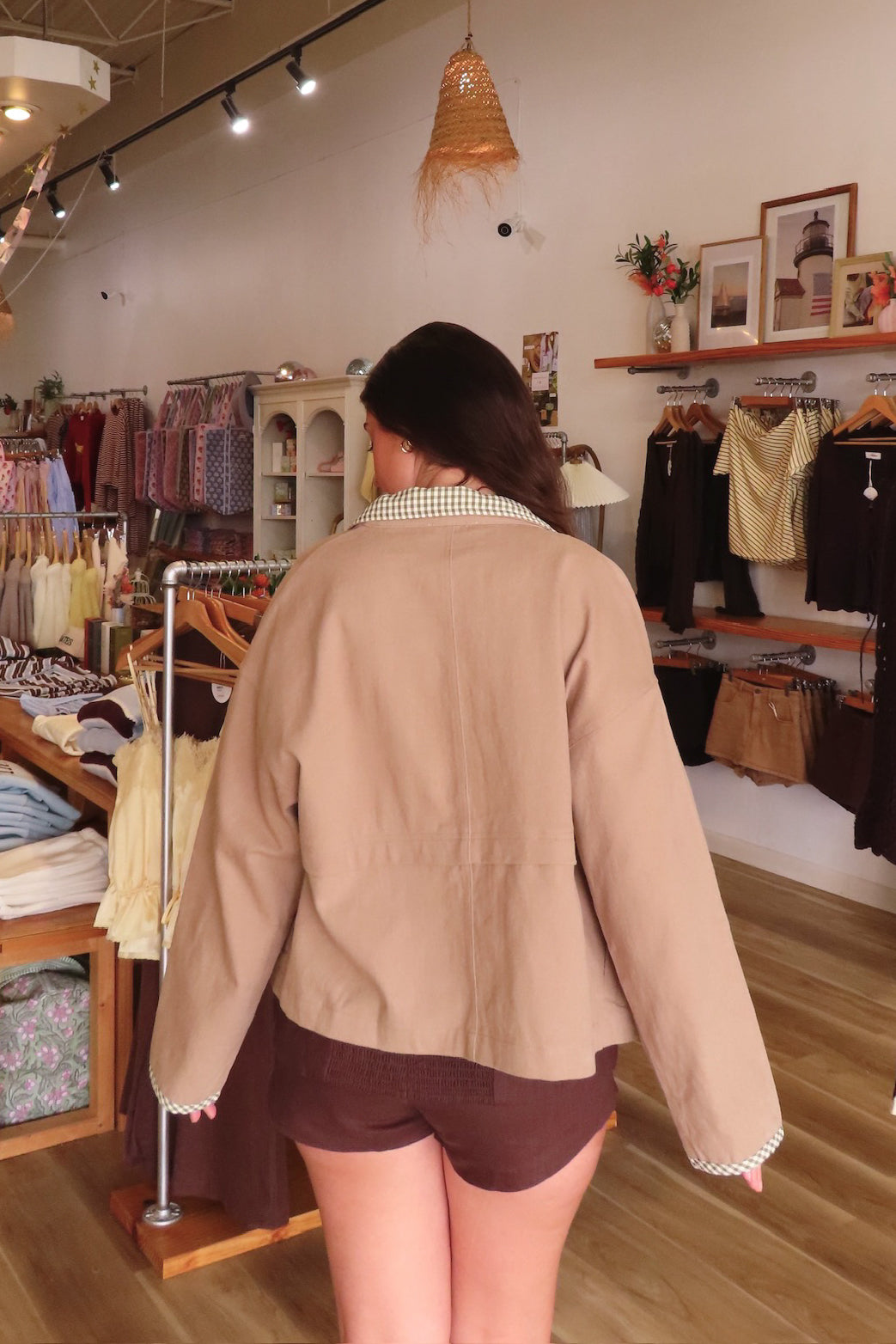 Brown, canvas jacket with green and white gingham contrast, collar, snap buttons, and oversized fit | Pixelated Boutique, Statement Jacket, Fall Fashion, Stylish Women’s Jacket, Fall Outerwear, Autumn Fashion, Fall Outfits Women, Fall Fashion 2026, Faux Leather Jacket, Women’s Jackets, Women’s Layering Pieces, Fall Outerwear Women