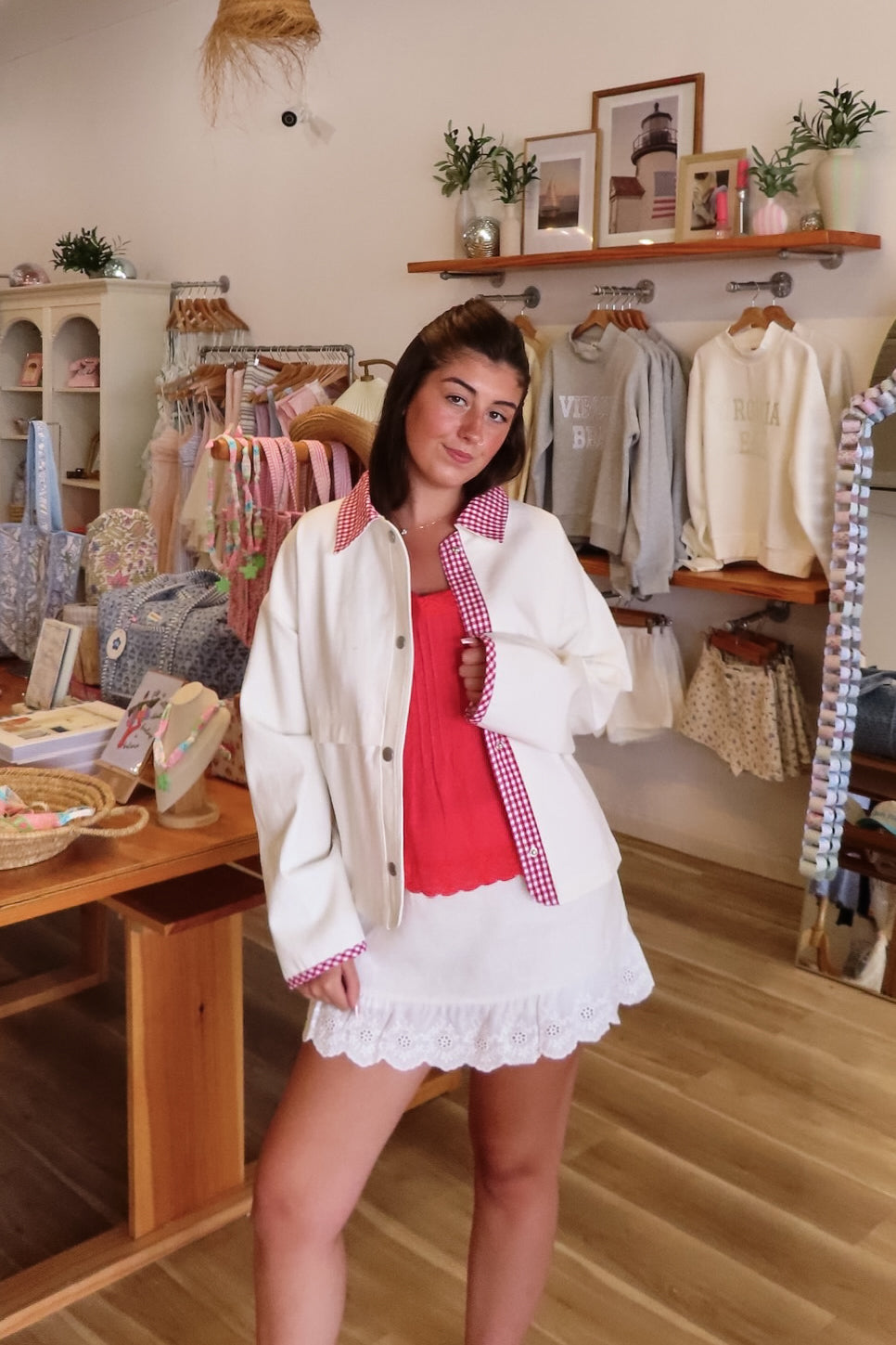 White, canvas jacket with red and white gingham contrast, collar, snap buttons, and oversized fit