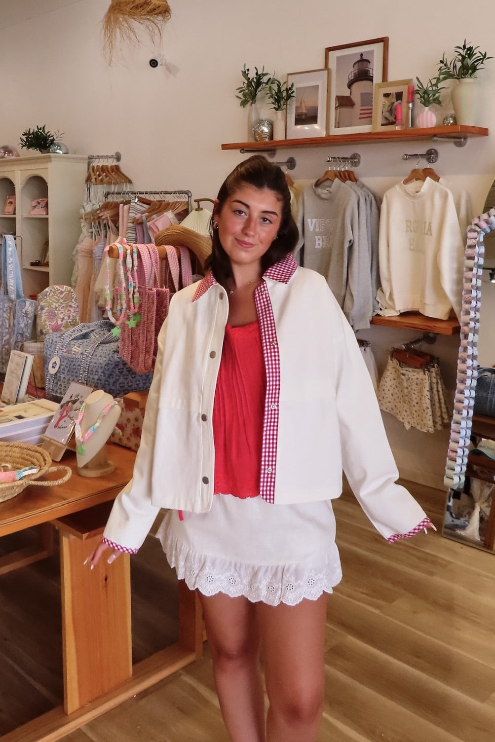 White, canvas jacket with red and white gingham contrast, collar, snap buttons, and oversized fit