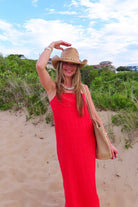 Red, linen maxi dress with straight neckline, adjustable cami straps, and flowy silhouette