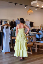 Pixelated Boutique, Women's Clothing, Online Shopping for Women, Fashion Trends 2026, Outfit Inspo, Virginia beach clothing stores, clothing stores in Virginia Beach, fashion outfits, fashion Inspo, women’s outfit 2026, outfit ideas, fashion, spring aesthetic, women’s spring outfit, spring style, spring break, maxi dress, yellow tiered dress, wedding guest dress 