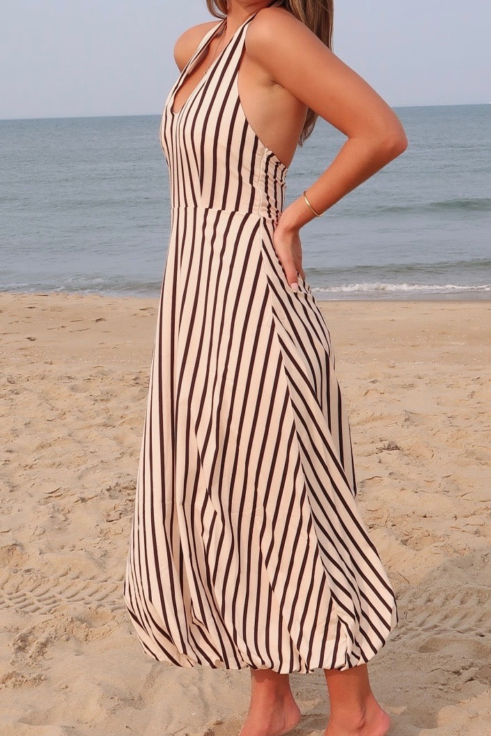 Tan and black, striped maxi dress with V neckline, halter tie, open back, and bubble hem | Pixelated Boutique, Women's Clothing, Boutique Clothing for Women, Women’s Formal Dress, Women’s Occasion Dress, Maxi Dress, Wedding Guest Dress, Prom Dress, Graduation Party Dress 