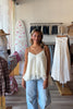 White, swing cami top with V neckline, asymmetric hem, ruffled chiffon layers, back tie, and adjustable straps
Pixelated Boutique, summer aesthetic, brunch outfit, vacation style, vacation outfits, beach boutique, beach fashion, beach outfits, women’s boutique clothing, boutique clothing for women, coastal cowgirl outfits, coastal aesthetic clothing, business casual, concert outfit, 2000s fashion, western outfits