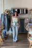 Blue, light wash jeans with low-rise, relaxed leg, and studded seams, studded jeans, vintage fit denim, summer denim, statement jeans for summer, low-rise jeans, low-rise light was denim, vacation outfits, beach outfits, coastal cowgirl, coastal aesthetic, beach girl fashion