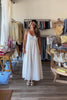 White, textured lace maxi dress with V neckline, front keyhole button, and adjustable open back, white maxi dress, white lace dress, boho maxi dress, bridal shower dress, bachelorette dress, graduation dress
