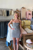 Brown, gingham mini dress with strapless neckline, fitted bodice, back zipper, and linen blend fabric