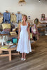 White, halter midi dress with square neckline, structured bodice, flared skirt, and side pockets | Pixelated Boutique, Virginia Beach Boutique, white maxi dress, white lace dress, boho maxi dress, bridal shower dress, bachelorette dress, graduation dress