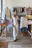 Cream, high-rise barrel jeans with curved leg and cuffed finish with buttons