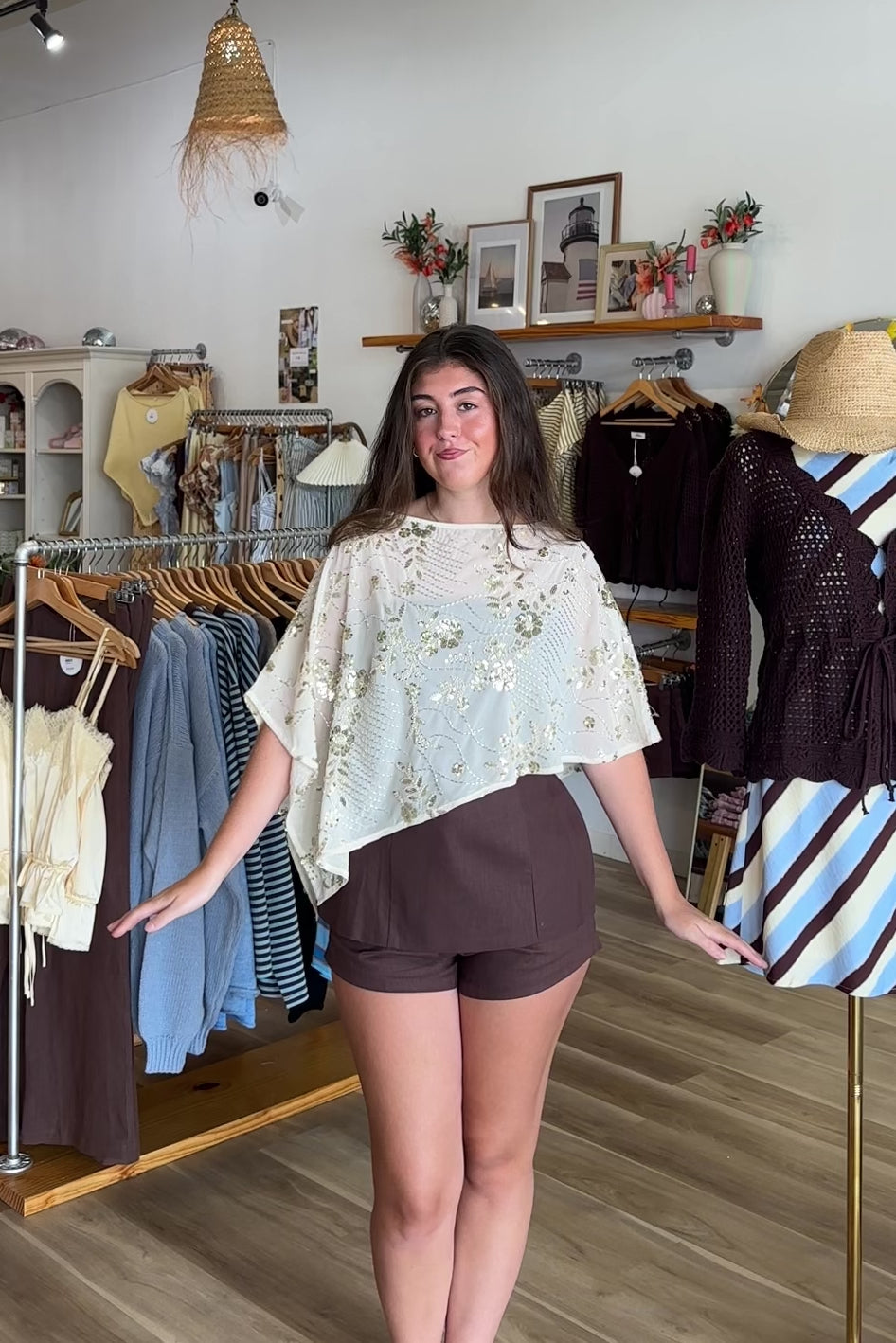Cream, floral sequin poncho with boat neckline, asymmetrical hem, and sheer fabric | Pixelated Boutique, Virginia Beach Clothing Stores, Clothing Stores in Virginia Beach, Virginia Beach Boutique, 757 Boutique, Beach Fashion, Vacation Style, Coastal Cowgirl Aesthetic
