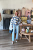 Blue, high-rise jeans with slight barrel leg and pockets