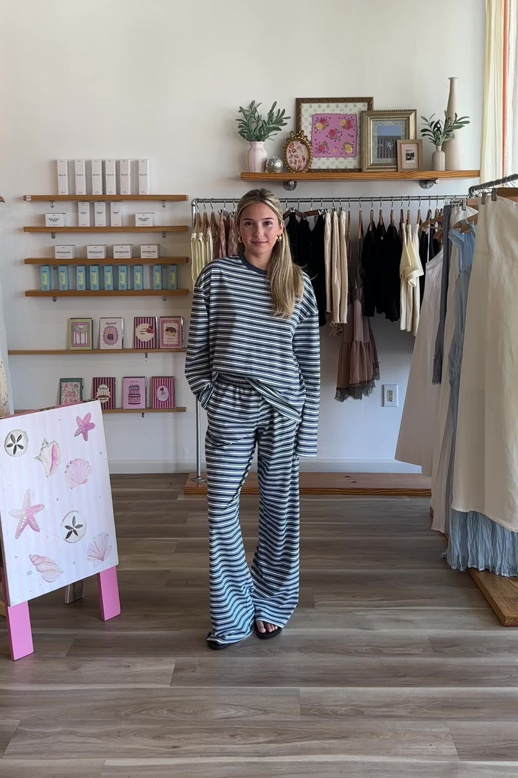 Blue, striped knit pants with wide leg, side pockets, and elastic waistband