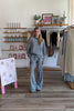 Blue, striped knit pants with wide leg, side pockets, and elastic waistband