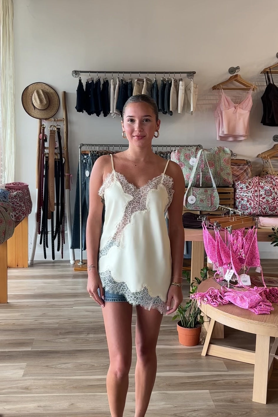 Cream, satin cami top with V neckline, asymmetric hem, scalloped lace trim, and adjustable straps, women’s lace going out top, date night lace top, asymmetrical hem top, girls night out top, vacation dinner outfit top