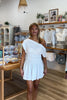 White, jersey mini dress with asymmetric off shoulder neckline, smocked waist, and flared skirt, coastal fashion, vacation dress, graduation dress, grad party dress, coastal cowgirl outfits, coastal aesthetic clothing, business casual, concert outfit, 2000s fashion, western outfits