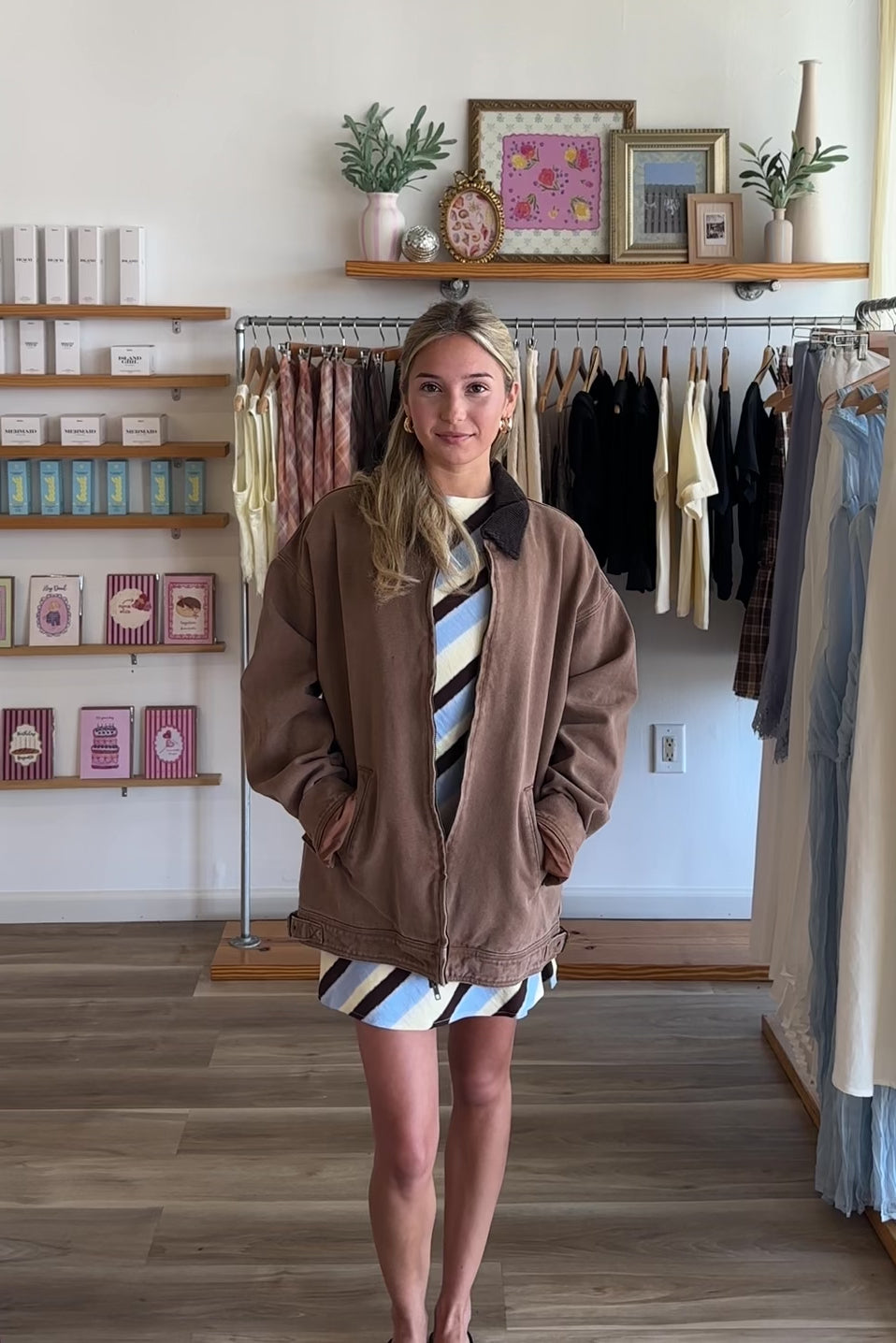 Brown, barn jacket with vintage wash, corduroy collar, side pockets, and hem buckles