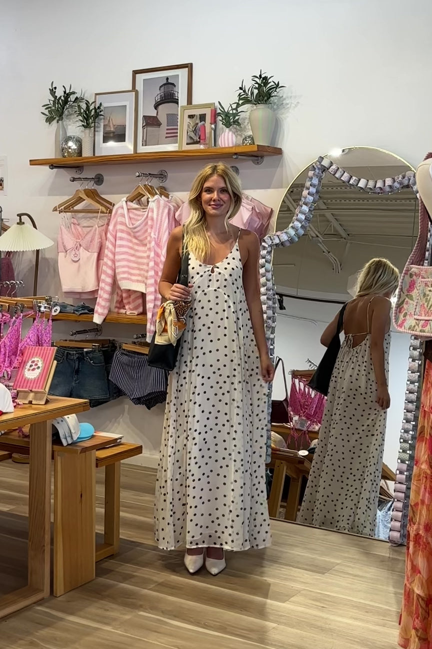 Cream, polka dot maxi dress with V neckline, keyhole cutout with button, back tie, and cross straps, Pixelated Boutique, 757 Boutique, fashion, summer aesthetic, women’s trendy summer outfit, spring break, vacation style, vacation outfits, beach boutique, beach fashion, beach outfits, coastal aesthetic clothing, maxi dress, formal dress, wedding guest dress, satin slip dress, prom dress, graduation party dress