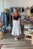 White, eyelet maxi skirt with ruffled tiers, elastic waistband, and drawstring, lace midi skirt, eyelet lace maxi skirt, summer maxi skirt, lace midi skirt for summer, bridal outfits, graduation dress, lace skirt for summer, beach fashion, coastal cowgirl aesthetic, beach girl outfits