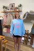 Pixelated Boutique, Women's Clothing, Online Shopping for Women, Fashion Trends 2026, Outfit Inspo, Virginia beach clothing stores, clothing stores in Virginia Beach, fashion outfits, fashion Inspo, women’s outfit 2026, outfit ideas, fashion, spring aesthetic, women’s spring outfit, spring style, spring break, crewneck, mother sweatshirt, Blue crewneck 