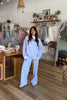 Blue and white, striped sweatpants with wide leg, elastic waist, contrast band, and side pockets.

By Sunkissed Coconut