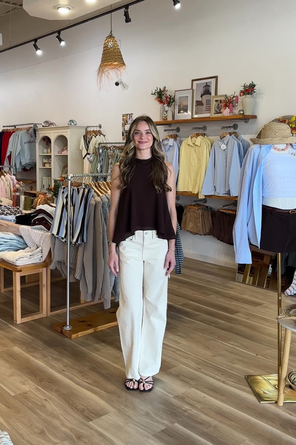 Cream, high-rise jeans with slight barrel leg, twist seam, and pockets